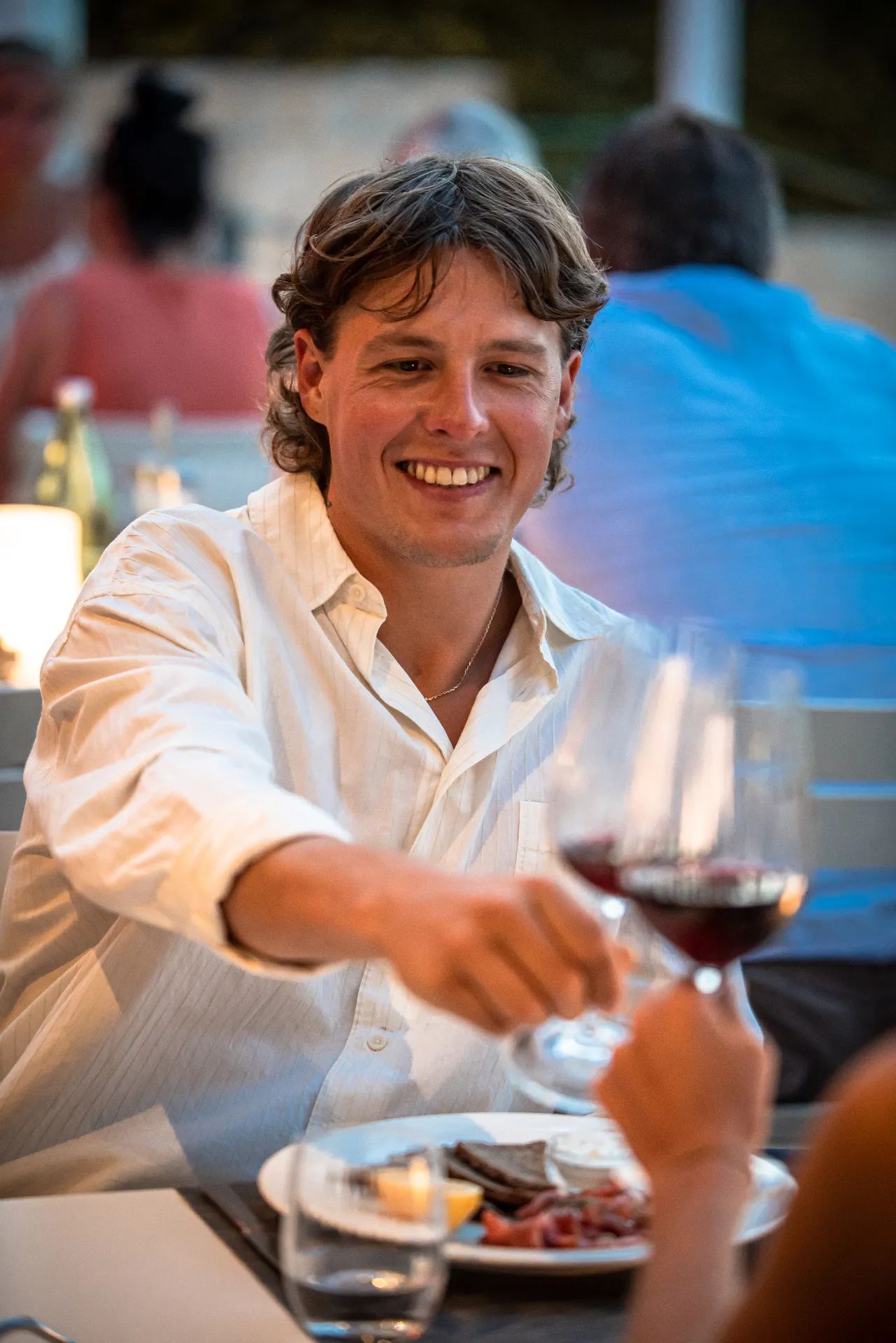 Mimi's Bistro — man cheering at dinner